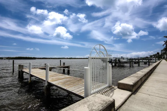 a view of a roof deck with couches and sky view