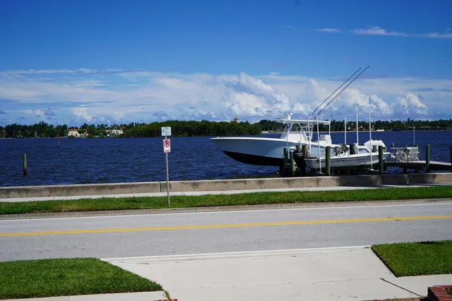 a front view of a house with garden and porch
