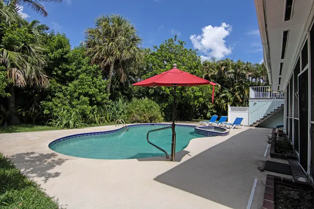 a view of pool with outdoor seating