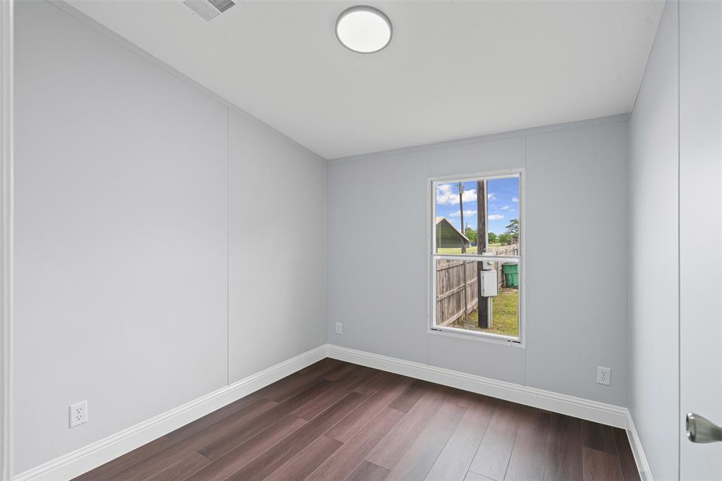 430 Indian Hills Road Bowie, TX 76230 - Photo 12 of 36 an empty room with window