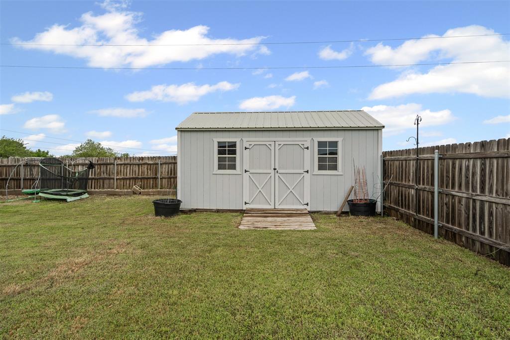 430 Indian Hills Road Bowie, TX 76230 - Photo 20 of 36 a view of a backyard