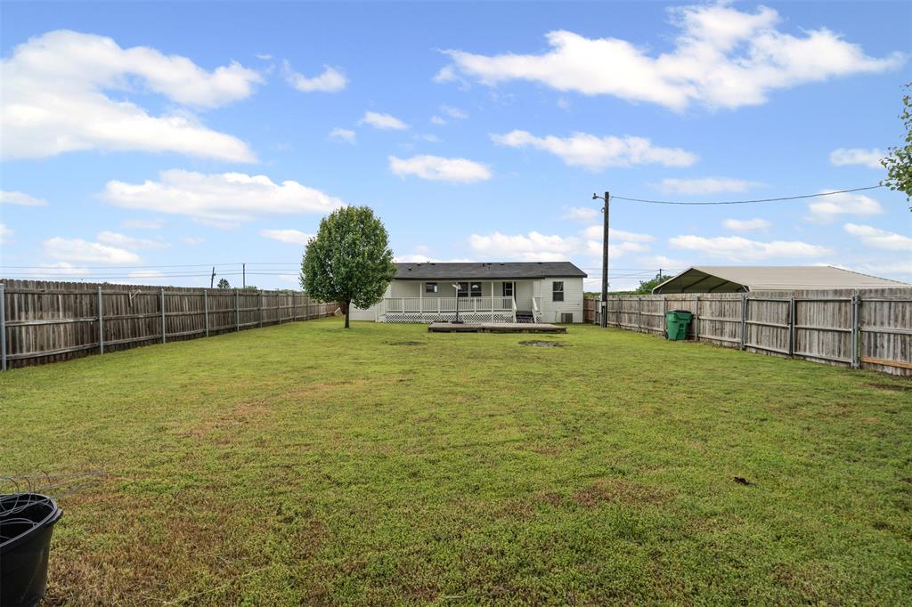 430 Indian Hills Road Bowie, TX 76230 - Photo 21 of 36 a front view of a house with a yard