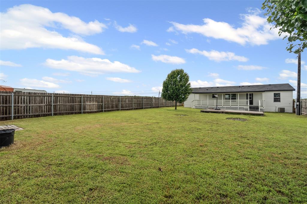 430 Indian Hills Road Bowie, TX 76230 - Photo 22 of 36 a view of an house with backyard space and balcony