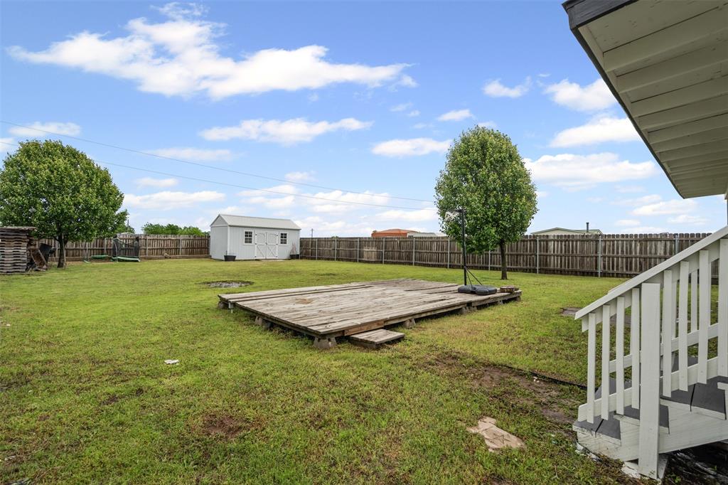 430 Indian Hills Road Bowie, TX 76230 - Photo 23 of 36 a view of a backyard with trampoline