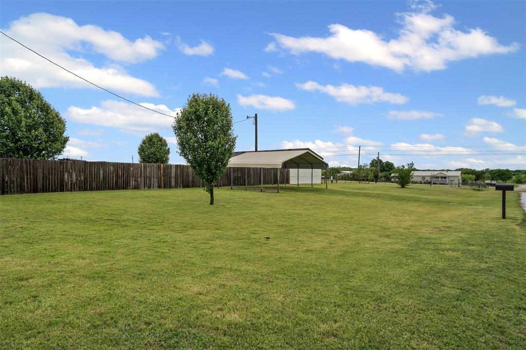 430 Indian Hills Road Bowie, TX 76230 - Photo 24 of 36 a view of a street with houses