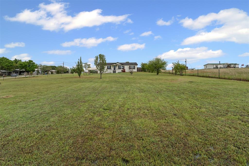 430 Indian Hills Road Bowie, TX 76230 - Photo 33 of 36 a view of an ocean and a yard