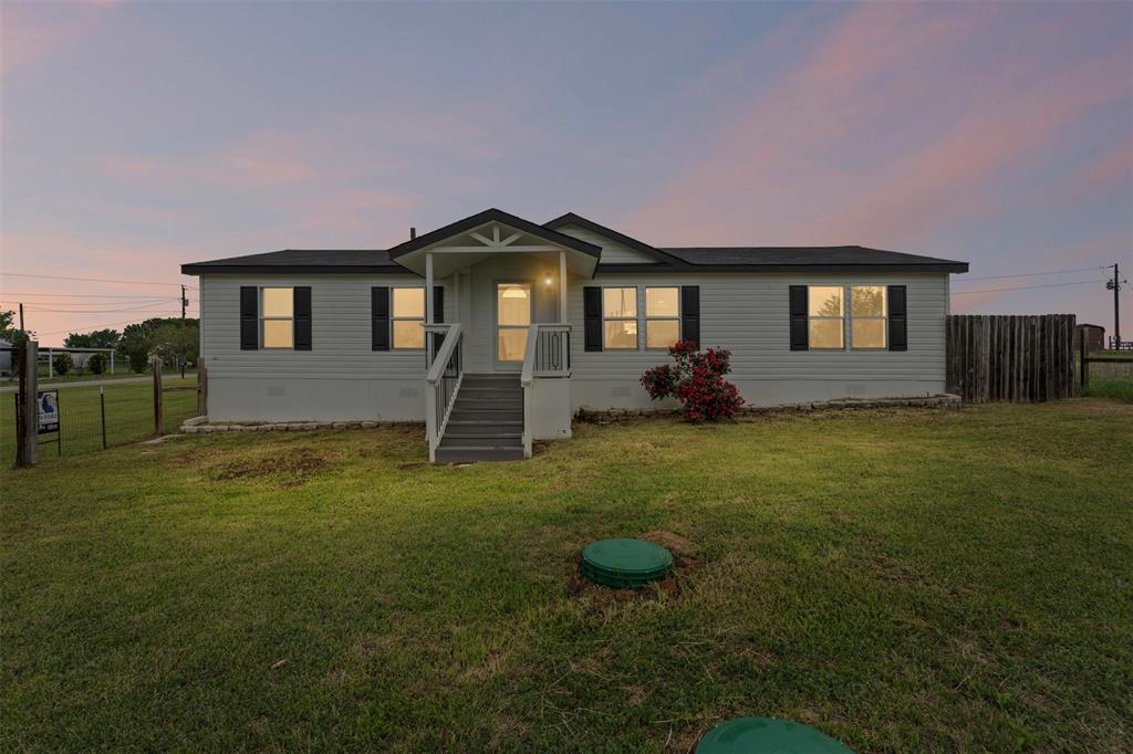 430 Indian Hills Road Bowie, TX 76230 - Photo 35 of 36 a front view of a house with a yard