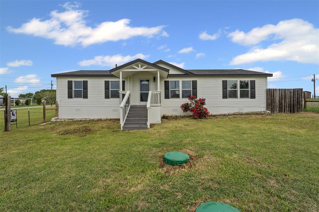 430 Indian Hills Road Bowie, TX 76230 - Photo 36 of 36 a front view of a house with a yard