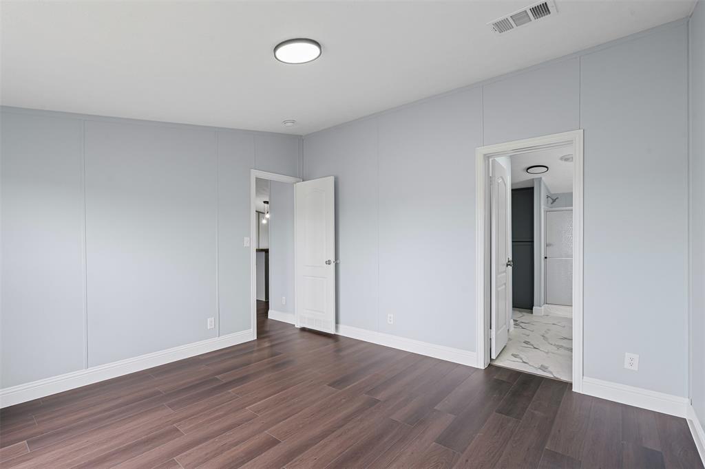 430 Indian Hills Road Bowie, TX 76230 - Photo 8 of 36 a view of an empty room with wooden floor and closet