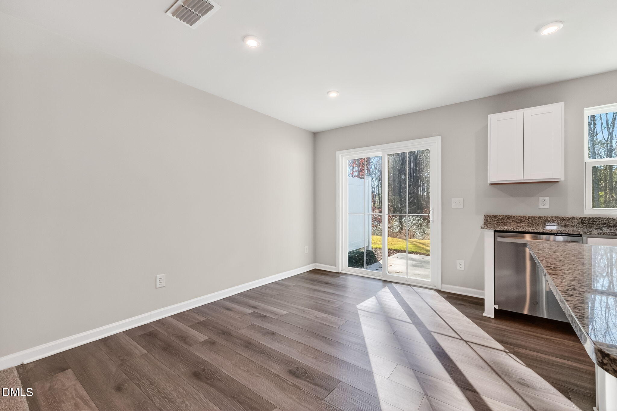 6684 Gibraltar Rock Drive Raleigh, NC 27610 - Photo 14 of 33 a view of a kitchen with a sink and a stove top oven