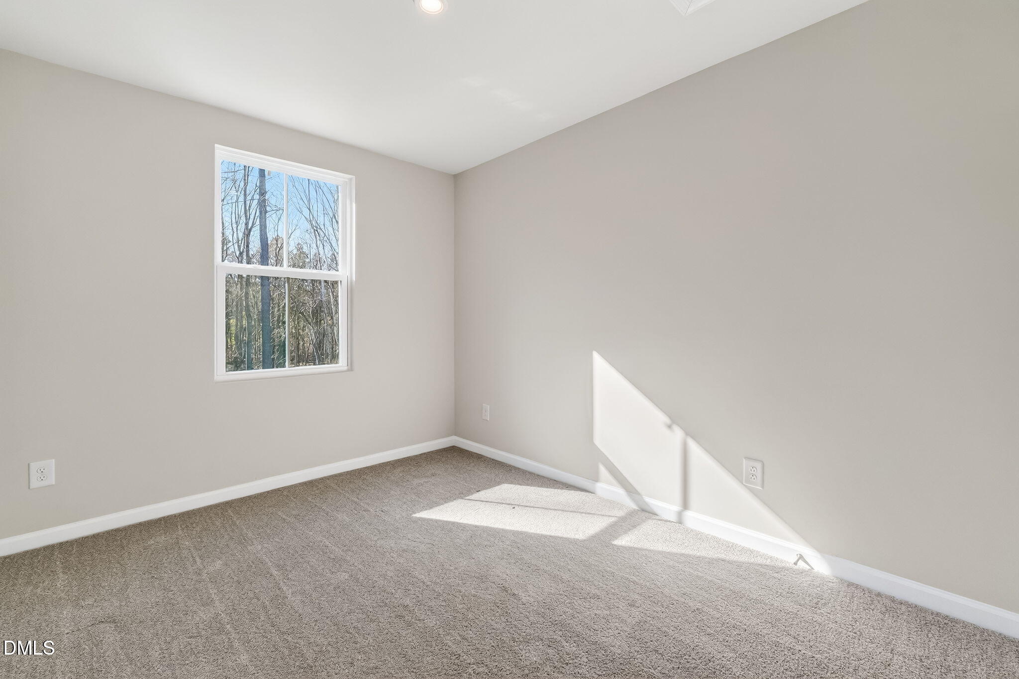 6684 Gibraltar Rock Drive Raleigh, NC 27610 - Photo 16 of 33 an empty room with a window