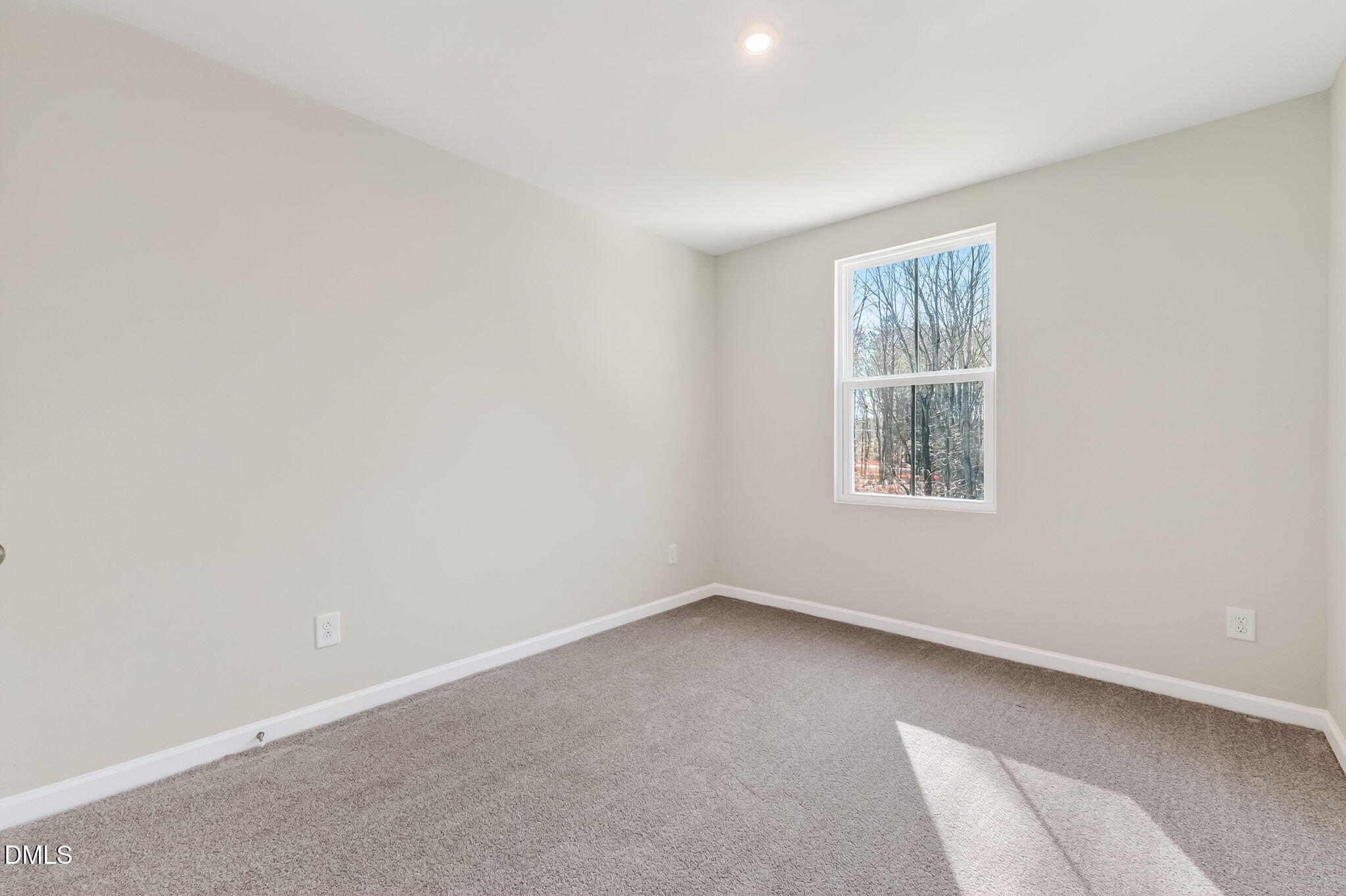 6684 Gibraltar Rock Drive Raleigh, NC 27610 - Photo 18 of 33 an empty room with a window