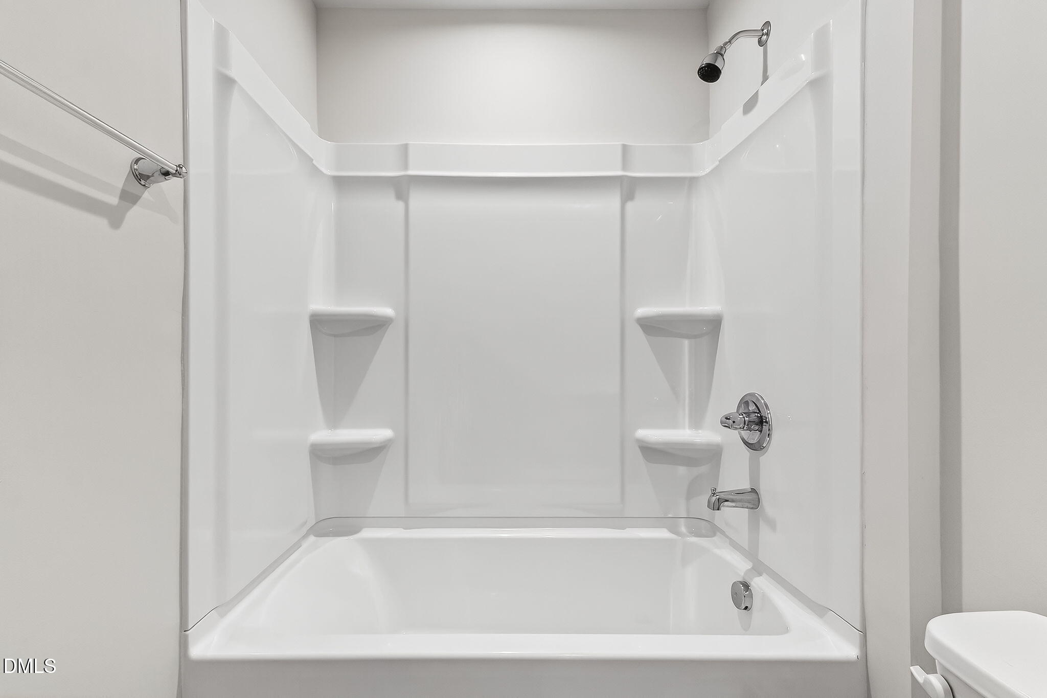 6684 Gibraltar Rock Drive Raleigh, NC 27610 - Photo 21 of 33 a white bath tub sitting next to a white toilet