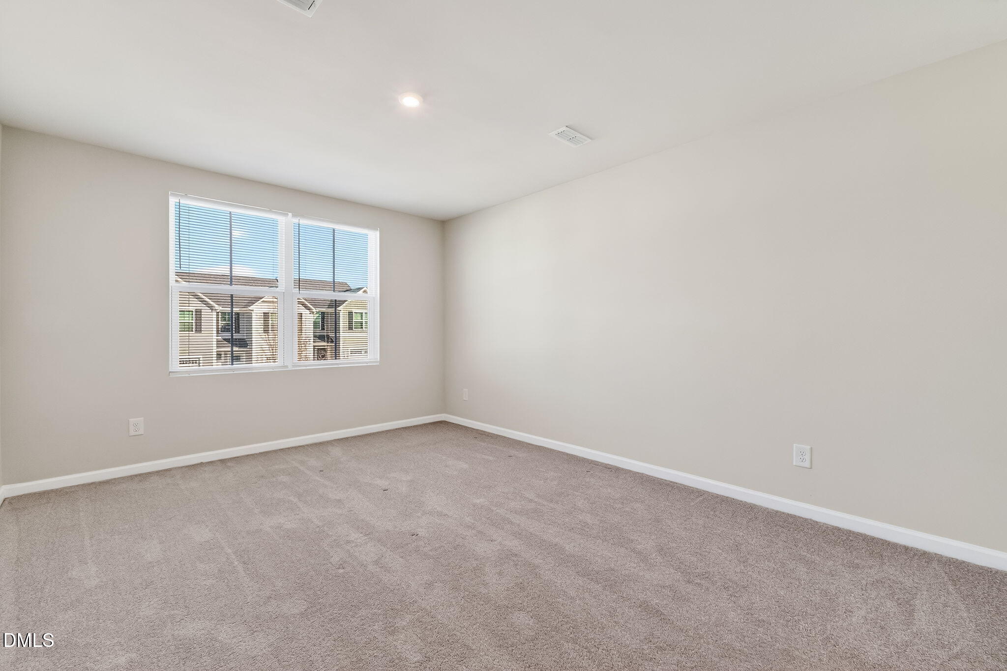 6684 Gibraltar Rock Drive Raleigh, NC 27610 - Photo 23 of 33 an empty room with windows
