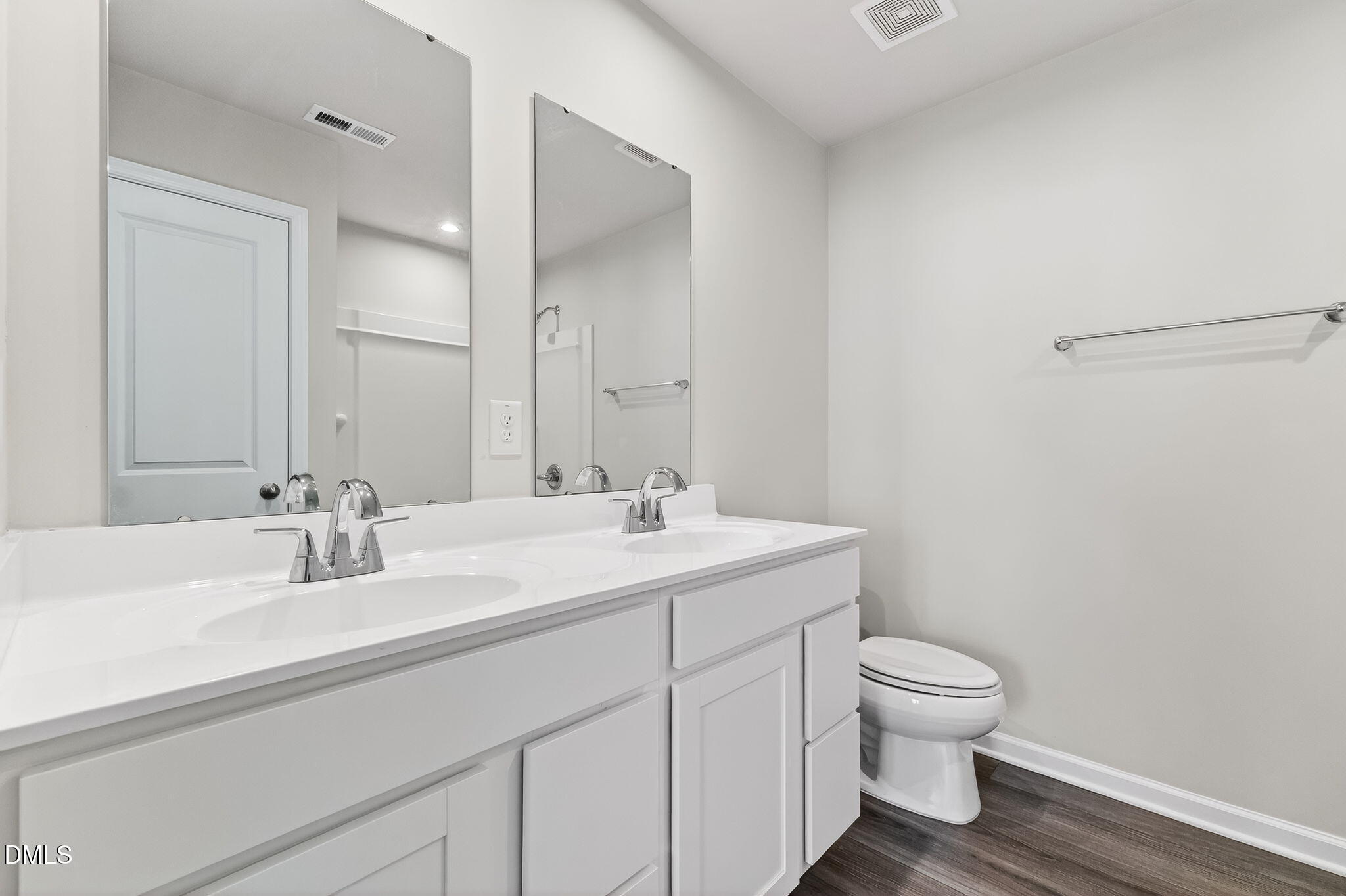 6684 Gibraltar Rock Drive Raleigh, NC 27610 - Photo 26 of 33 a bathroom with a sink toilet and vanity
