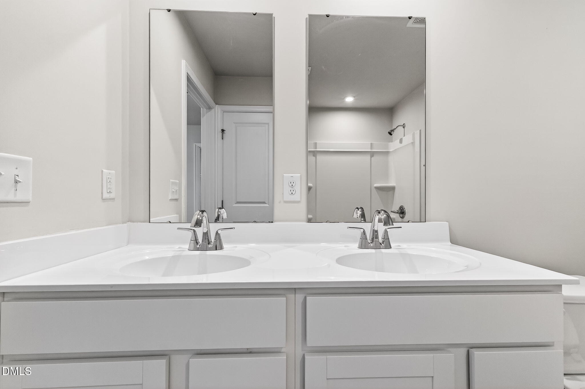 6684 Gibraltar Rock Drive Raleigh, NC 27610 - Photo 27 of 33 a bathroom with a sink and a mirror