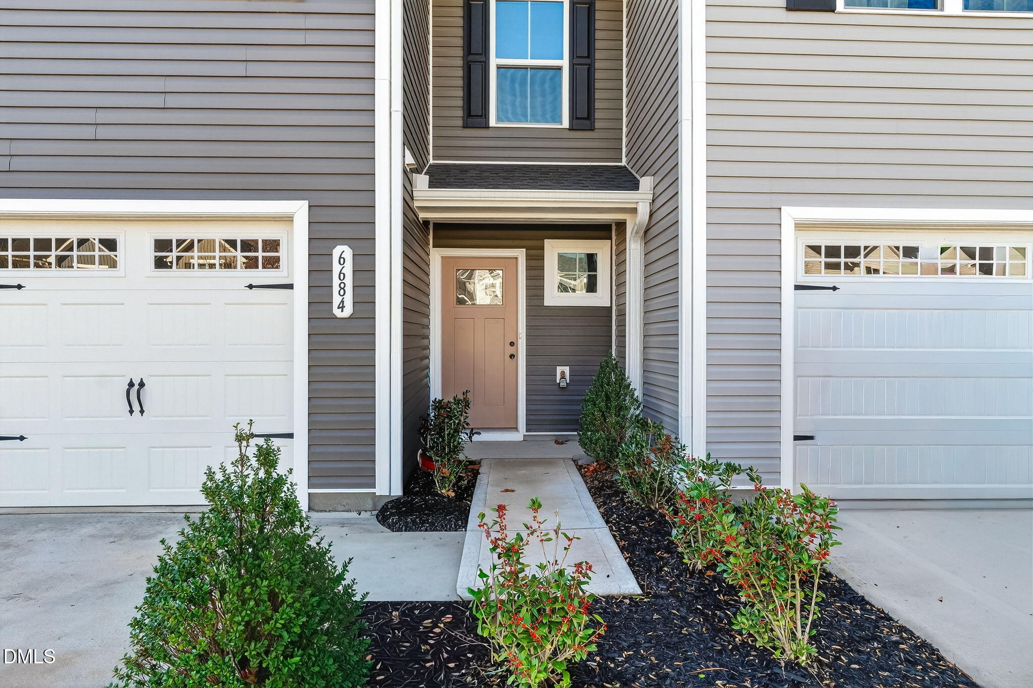 6684 Gibraltar Rock Drive Raleigh, NC 27610 - Photo 5 of 33 a view of a house with potted plants