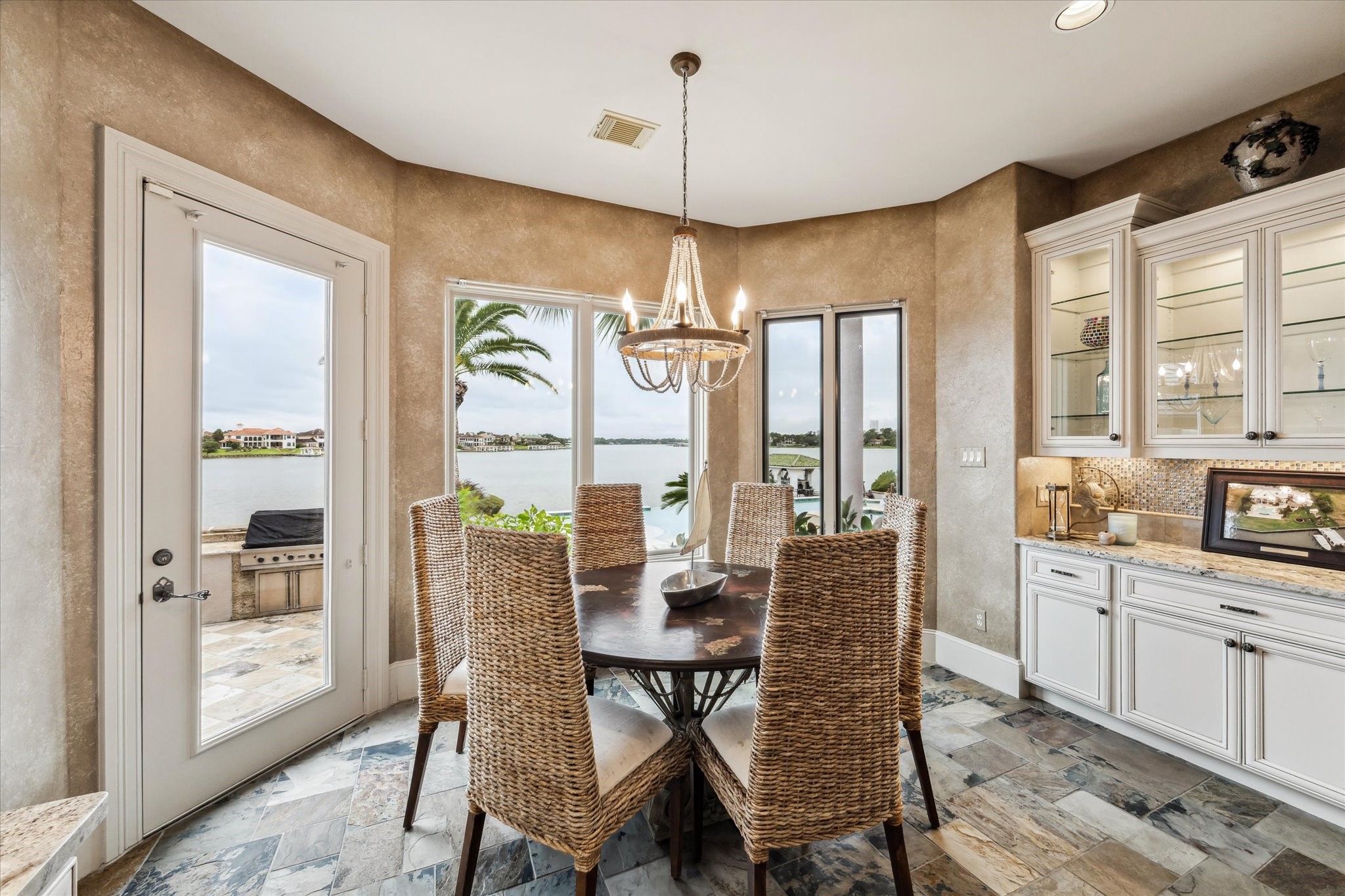 1818 Ray Shell Court Seabrook, TX 77586 - Photo 13 of 50 a dining room with furniture a chandelier and wooden floor