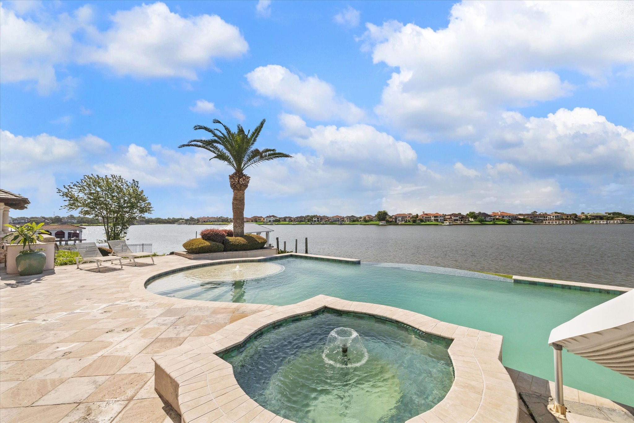 1818 Ray Shell Court Seabrook, TX 77586 - Photo 2 of 50 a view of a lake with a swimming pool and a yard