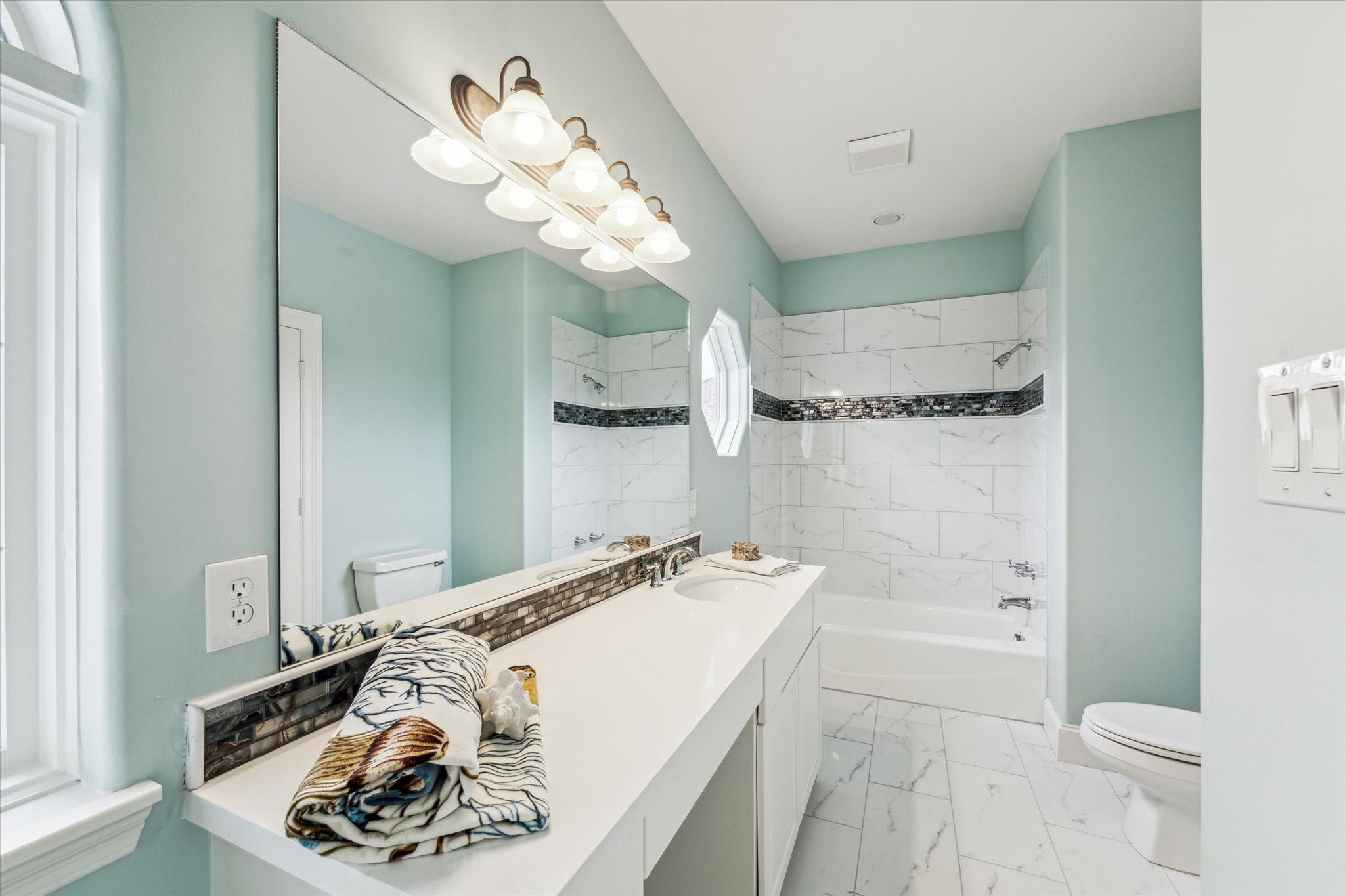 1818 Ray Shell Court Seabrook, TX 77586 - Photo 21 of 50 a bathroom with a sink a toilet and a shower