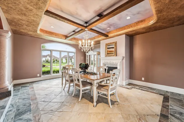 a view of a dining room with furniture and a window