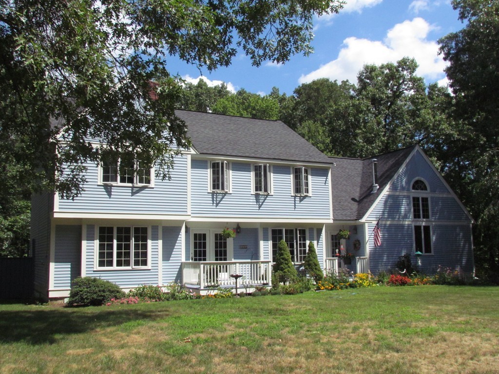121 Lawton Road Shirley, MA 01464 - Photo 3 of 30 a front view of a house with a garden