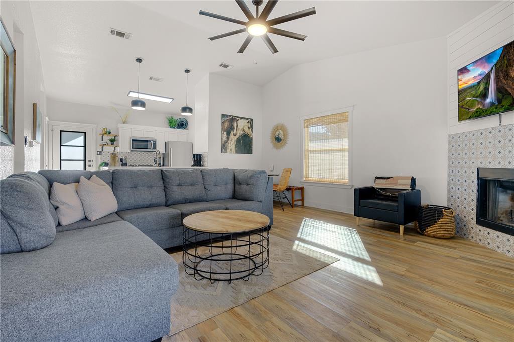 1782 Fm 2951, Unit 2 Graford, TX 76449 - Photo 8 of 21 a living room with furniture and a fireplace