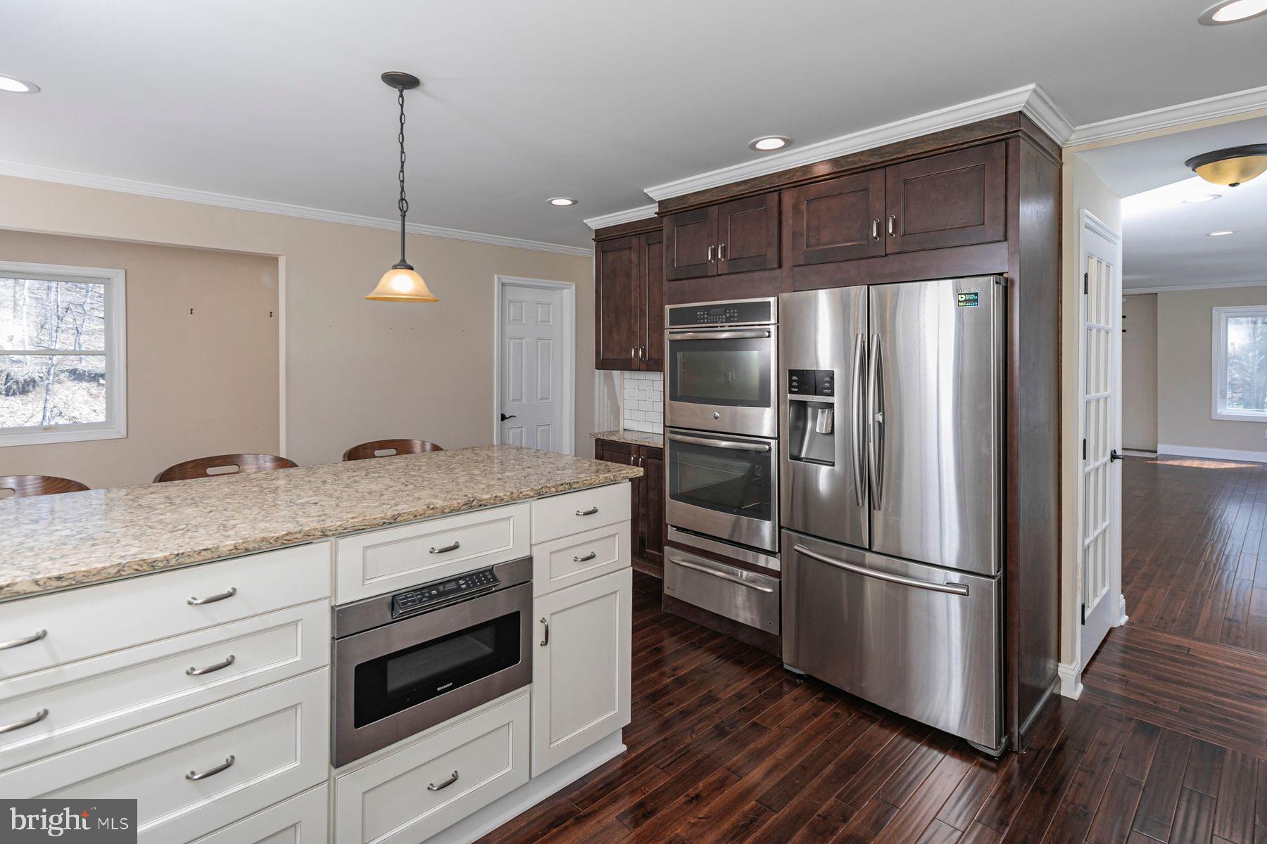 310 Hollow Road Skillman, NJ 08558 - Photo 13 of 32 a kitchen with granite countertop stainless steel appliances a refrigerator and a sink