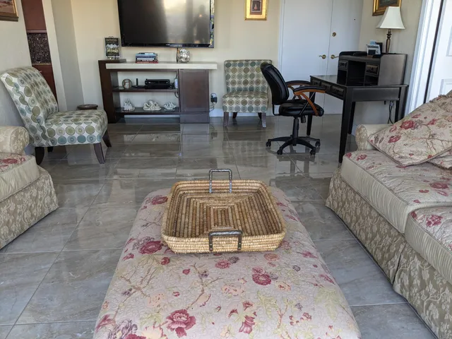 a view of a dining room with furniture and window