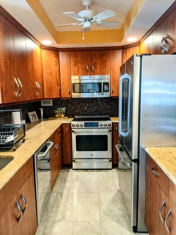 a bedroom with a large bed and a couch