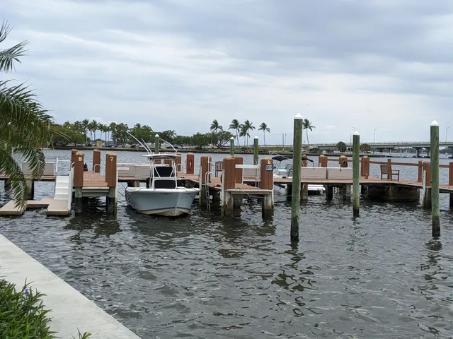 a view of a swimming pool with outdoor seating