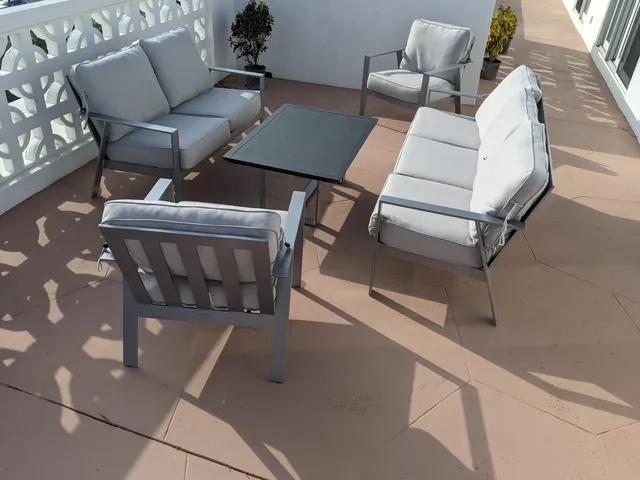 a view of a lake with a floor to ceiling window and stairs