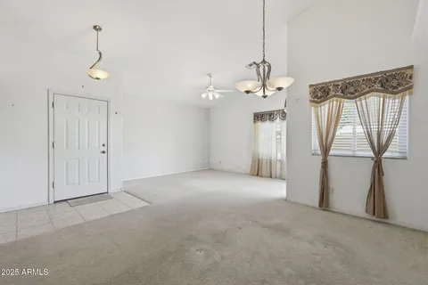 a kitchen with a refrigerator and a sink