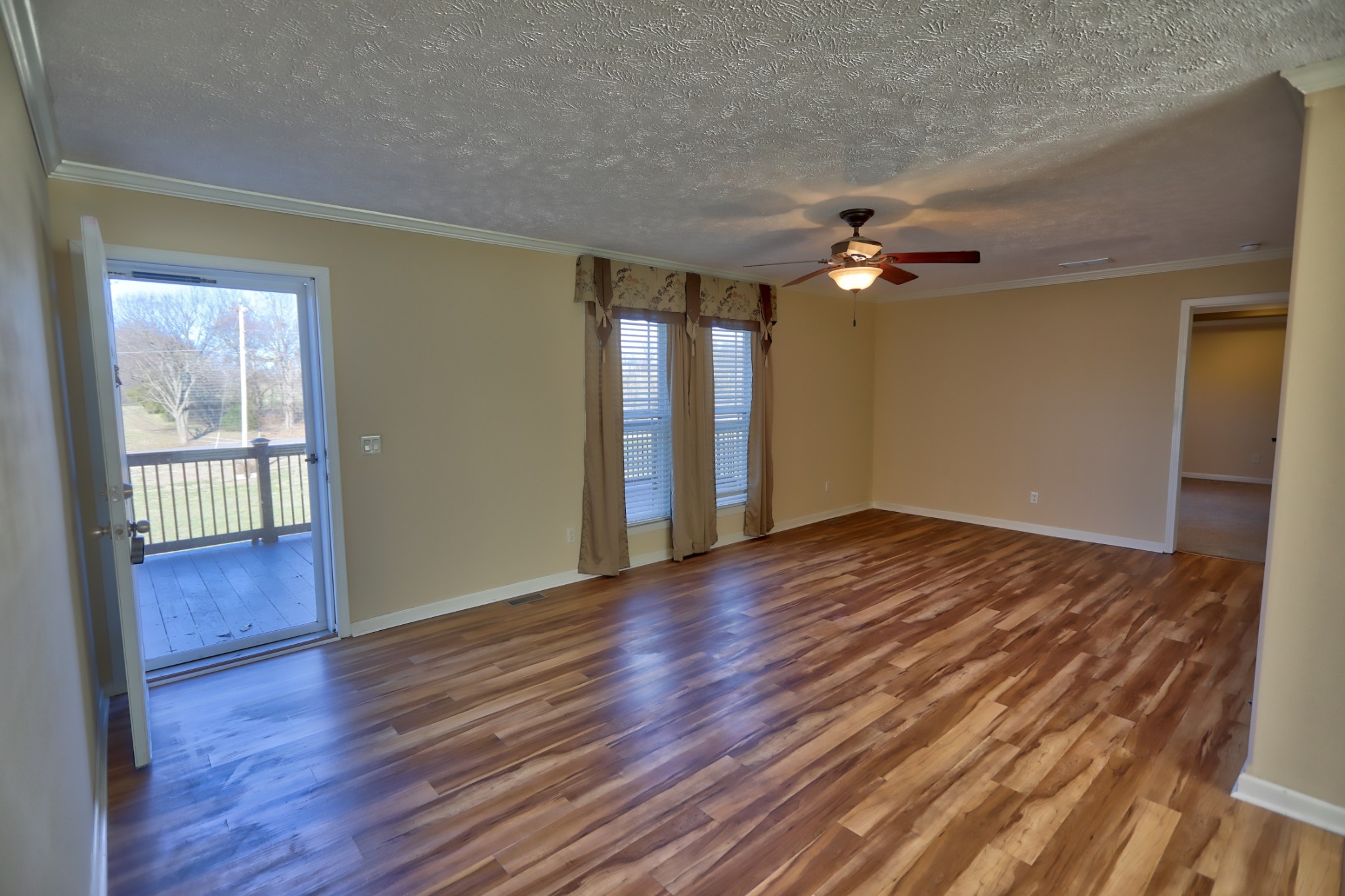 7438 Chowning Road Springfield, TN 37172 - Photo 15 of 33 a view of an empty room with window and wooden floor