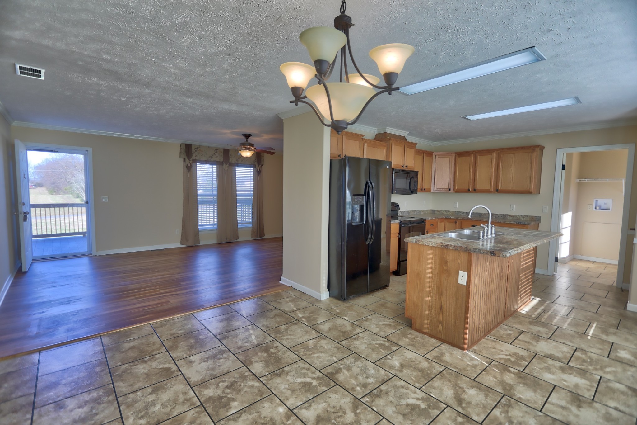 7438 Chowning Road Springfield, TN 37172 - Photo 17 of 33 a view of a kitchen with refrigerator and cabinets