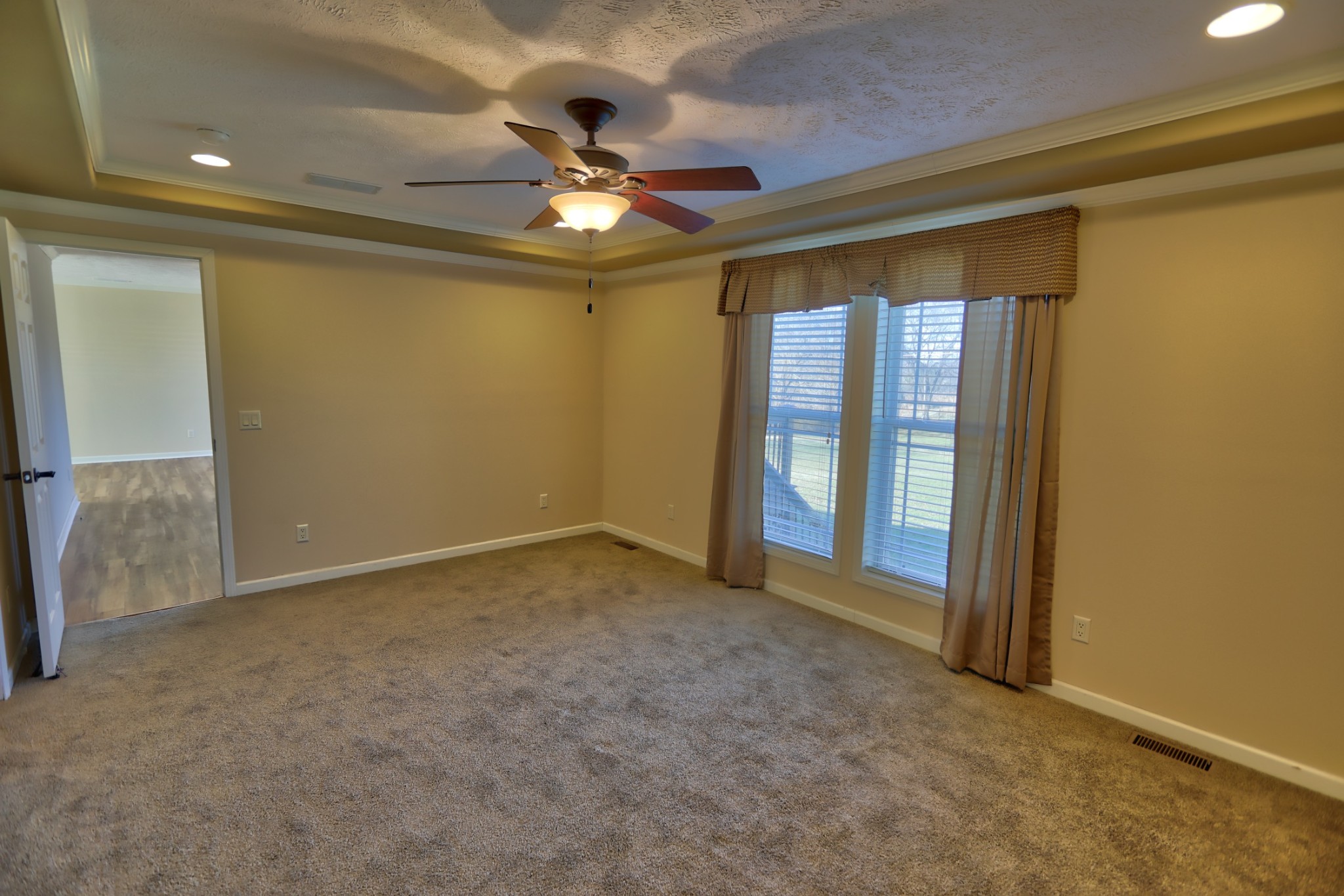 7438 Chowning Road Springfield, TN 37172 - Photo 23 of 33 an empty room with chandelier fan and windows