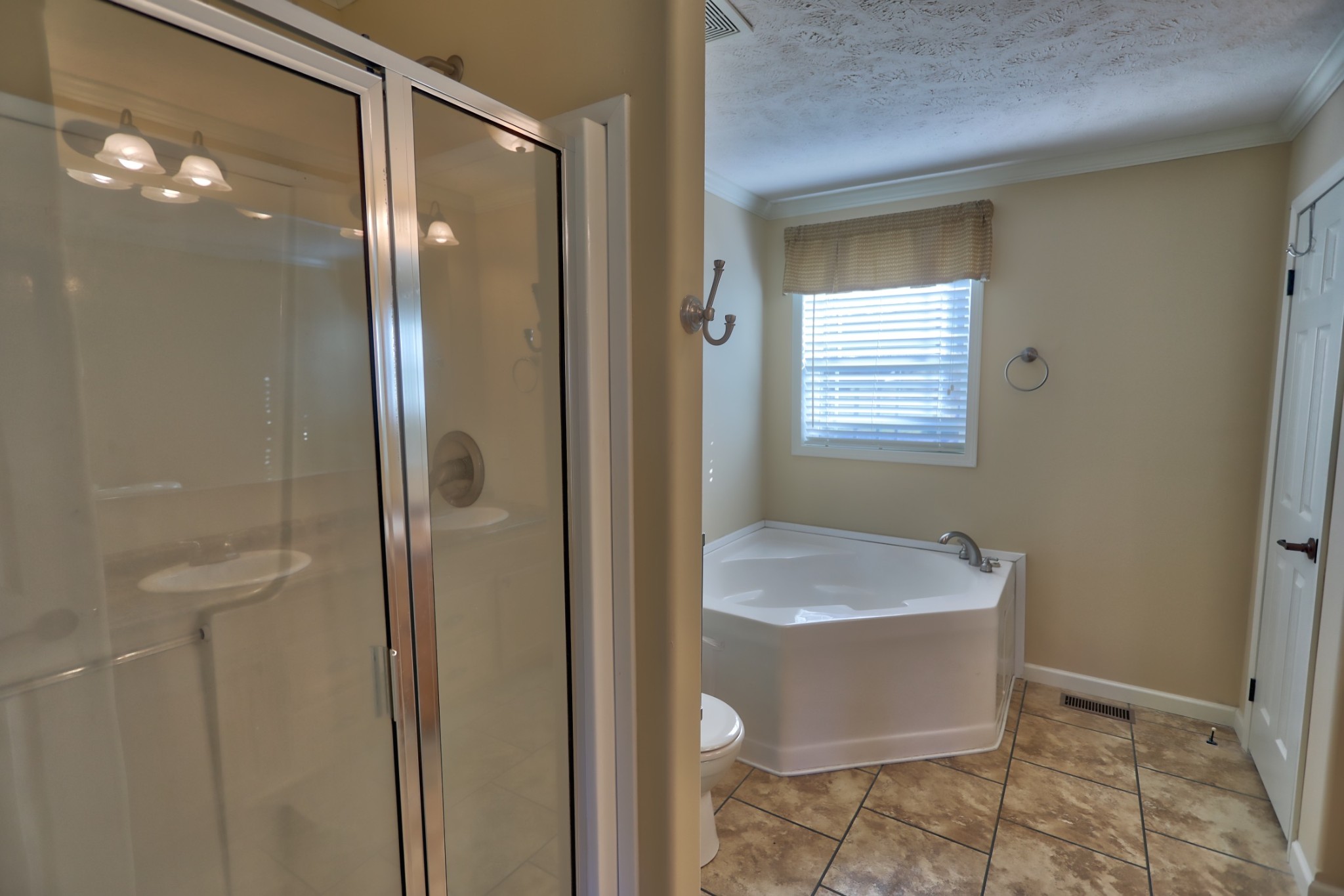7438 Chowning Road Springfield, TN 37172 - Photo 25 of 33 a bathroom with a granite countertop sink a shower and a mirror