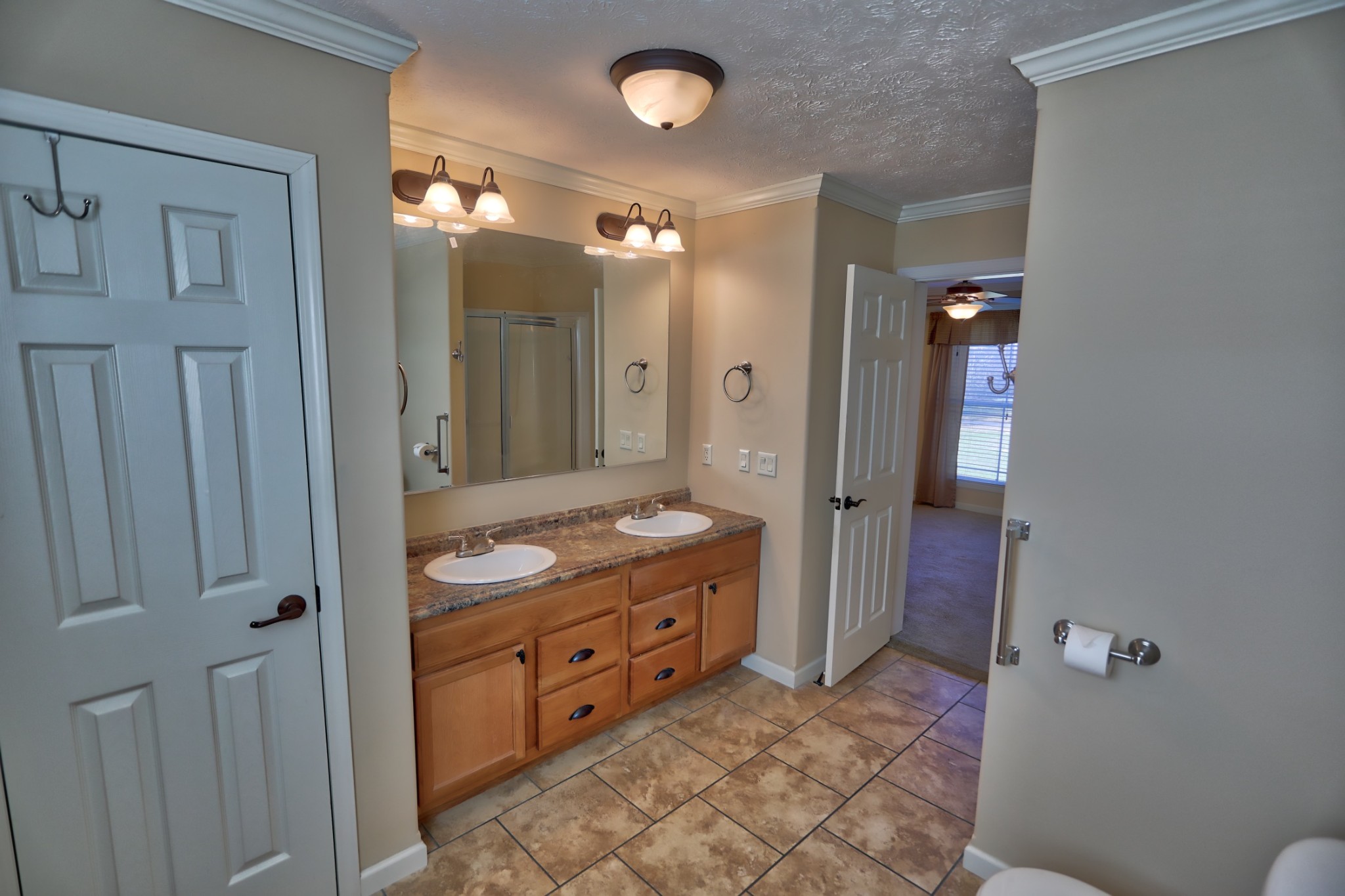 7438 Chowning Road Springfield, TN 37172 - Photo 26 of 33 a bathroom with a granite countertop sink a mirror and a shower