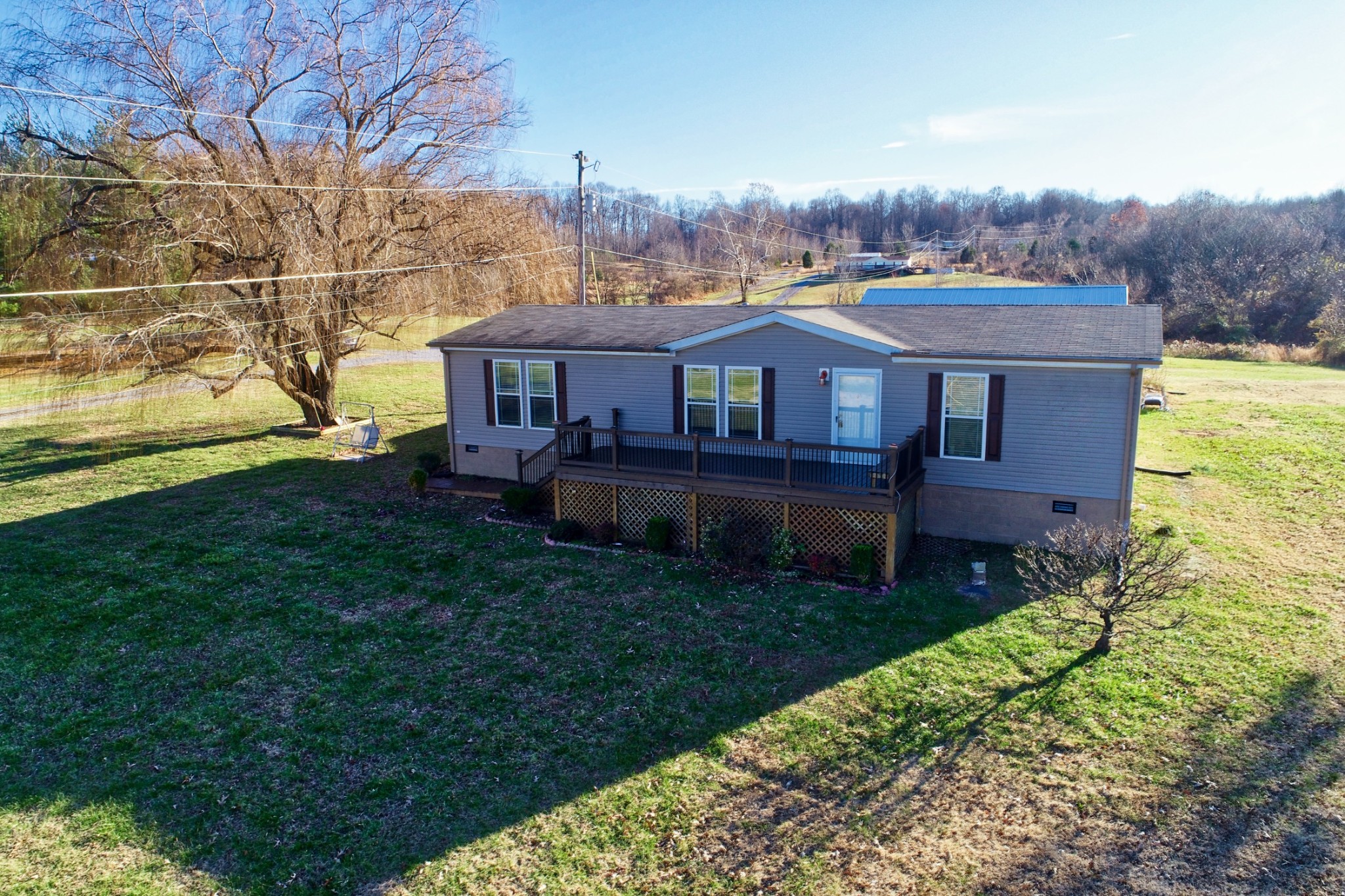 7438 Chowning Road Springfield, TN 37172 - Photo 5 of 33 a view of a house with a big yard potted plants and large tree