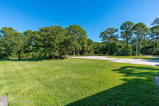 a view of swimming pool with a yard
