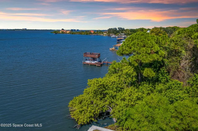 a view of a lake with a building in the background