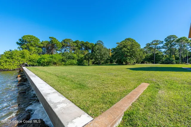 a view of a field with an ocean