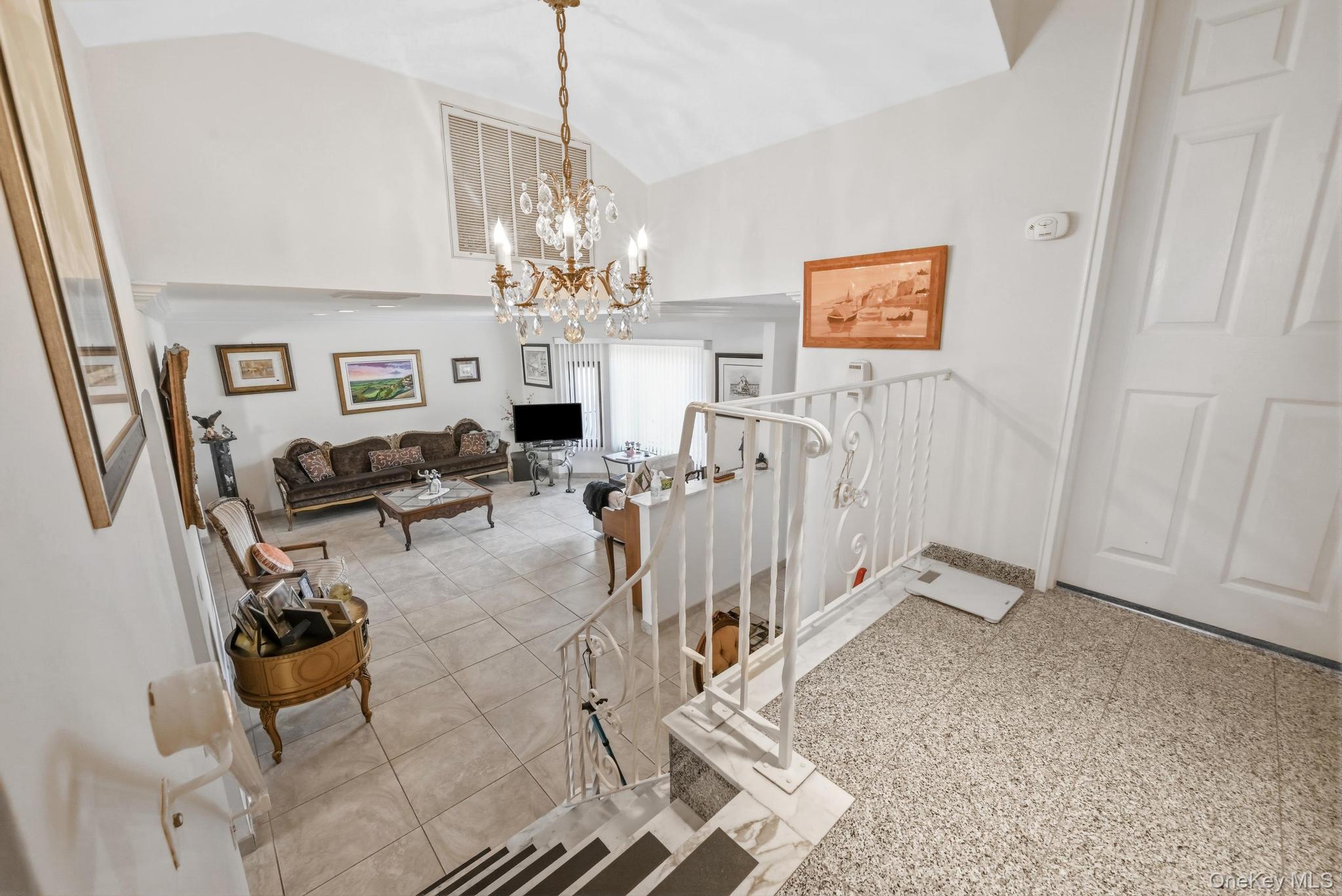 3 Chapin Road Farmingdale, NY 11735 - Photo 14 of 26 a view of a livingroom with a furniture wooden floor a chandelier