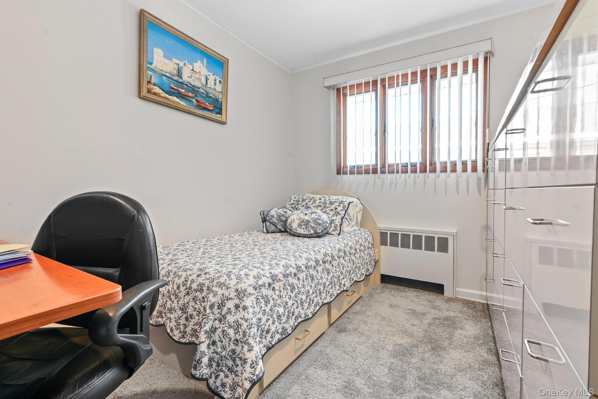 3 Chapin Road Farmingdale, NY 11735 - Photo 17 of 26 a bedroom with a bed and a window
