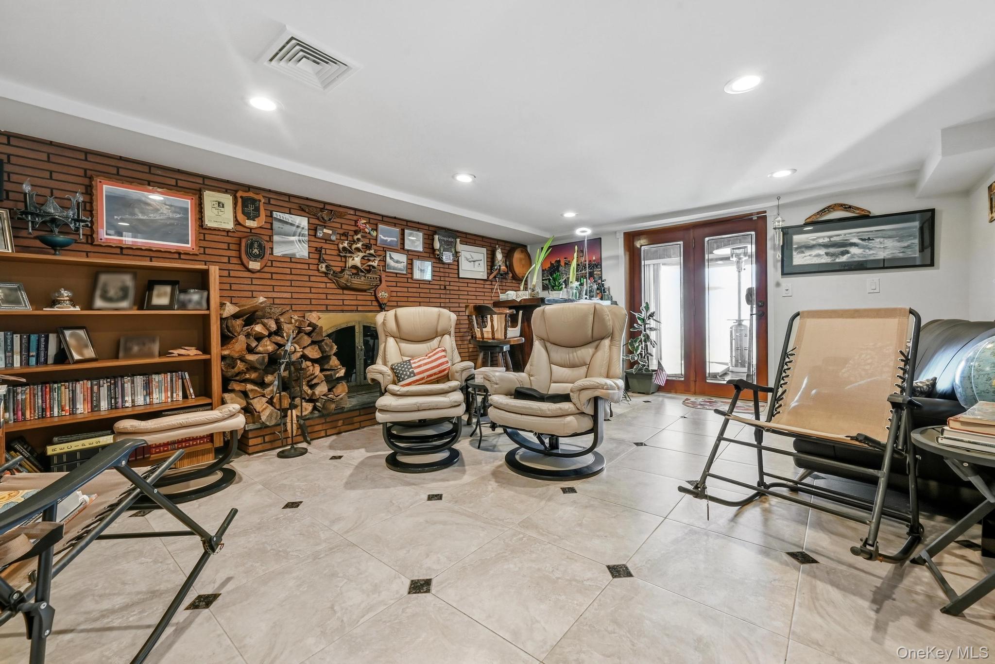 3 Chapin Road Farmingdale, NY 11735 - Photo 20 of 26 a living room with furniture a rug and a book shelf