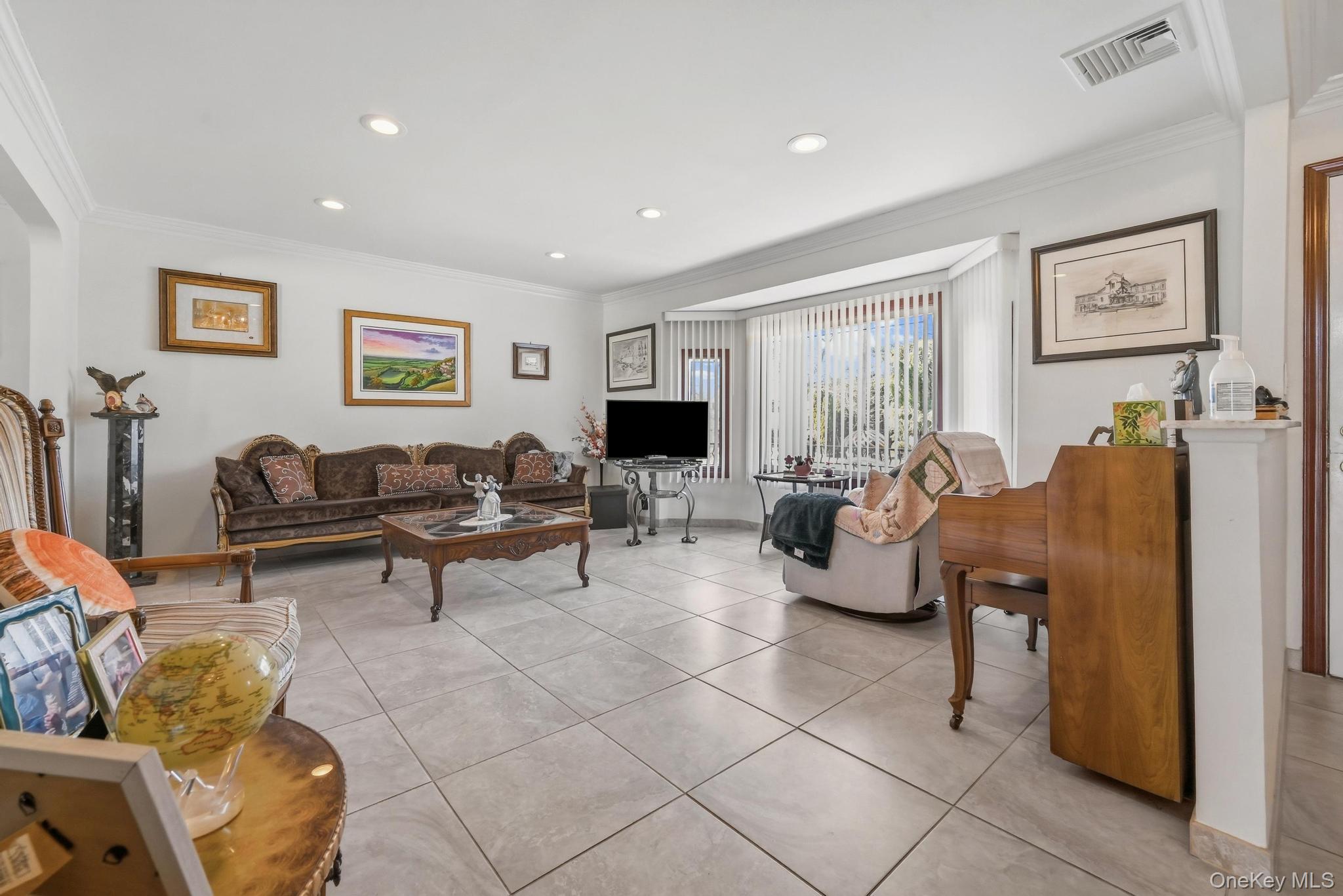 3 Chapin Road Farmingdale, NY 11735 - Photo 8 of 26 a living room with furniture and a flat screen tv