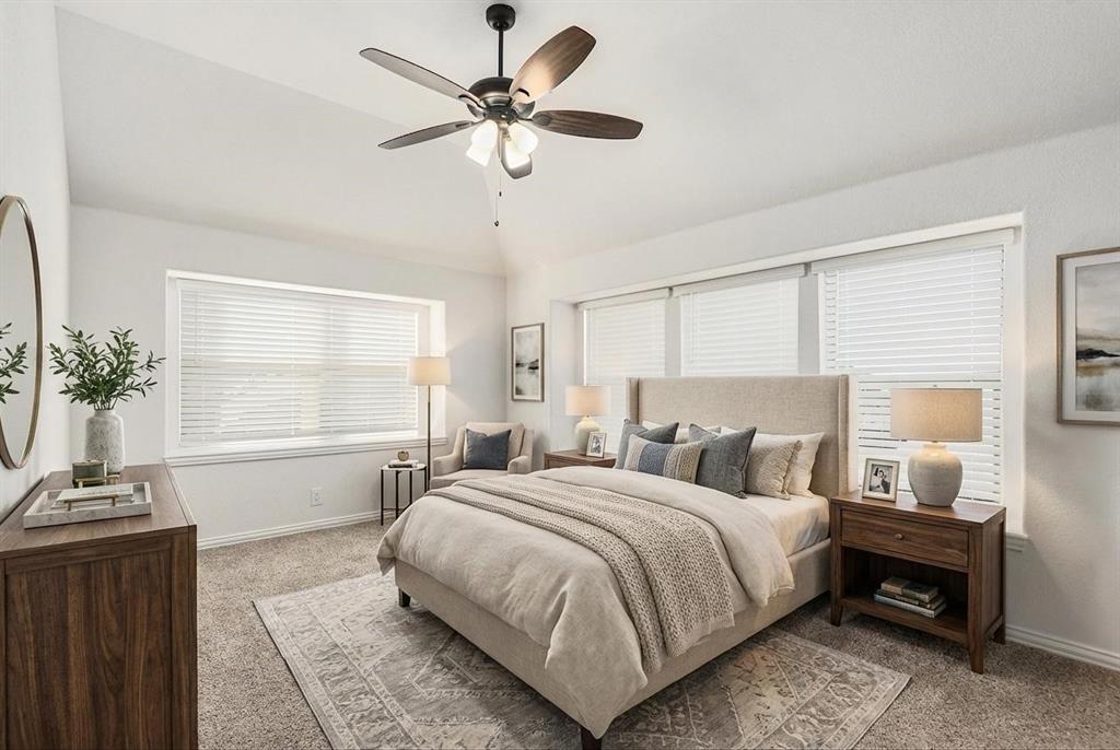 303 Pineview Lane Ponder, TX 76259 - Photo 13 of 19 a bedroom with a bed a chandelier and a window