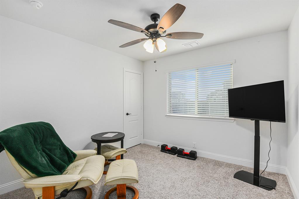 303 Pineview Lane Ponder, TX 76259 - Photo 16 of 19 a living room with furniture and a flat screen tv