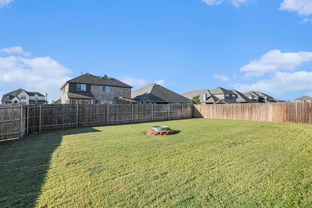 303 Pineview Lane Ponder, TX 76259 - Photo 19 of 19 a swimming pool with tall buildings in the background