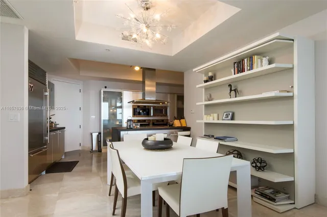 a kitchen with a refrigerator a stove a microwave and cabinets